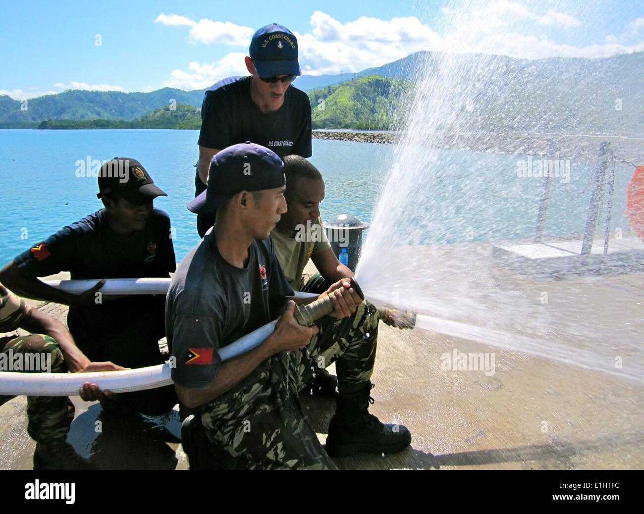 U.S. Coast Guard Chief Machinery Technician Danny Dupepe, standing