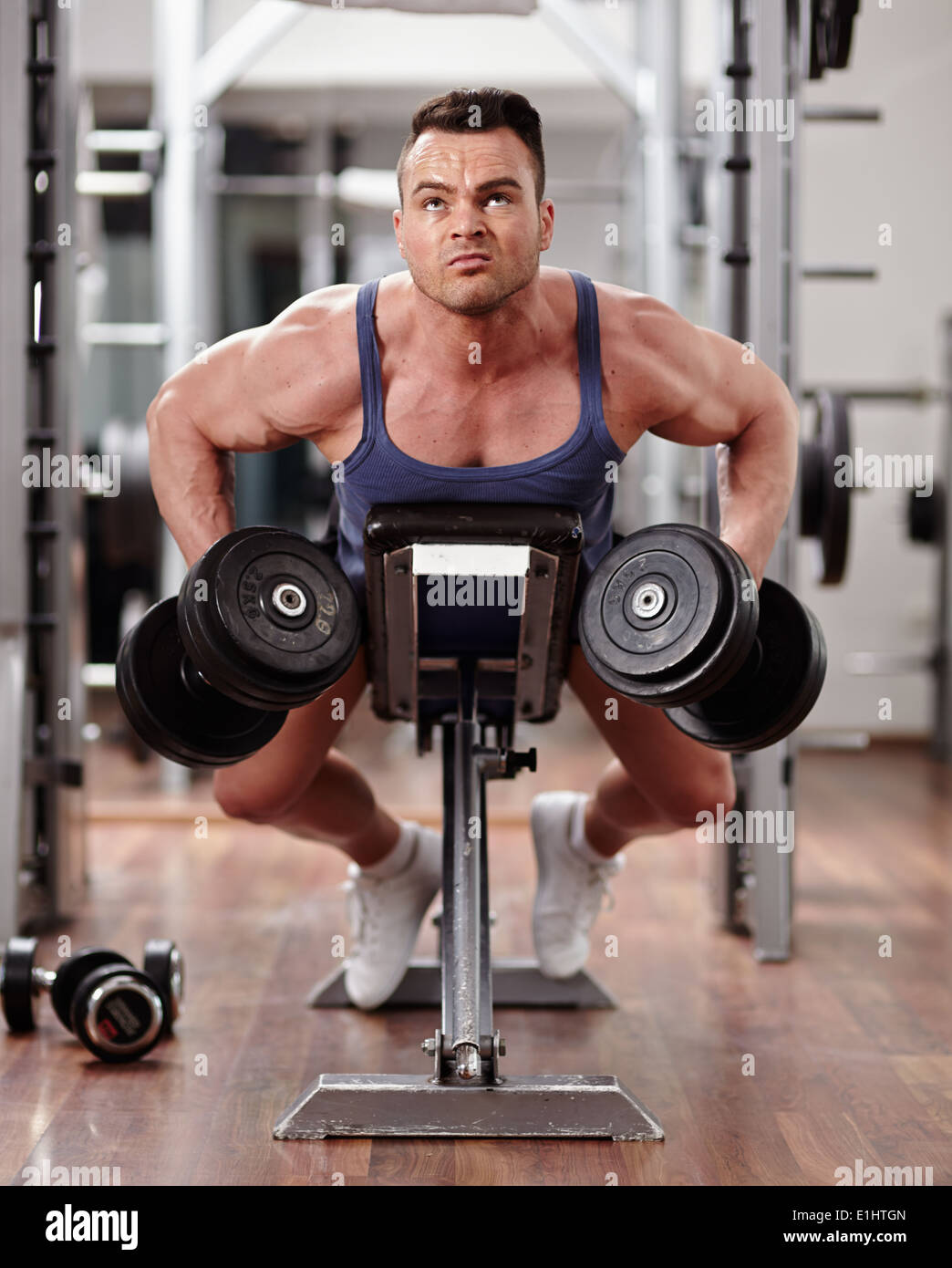 Man doing dumbbell row workout for back muscles Stock Photo - Alamy