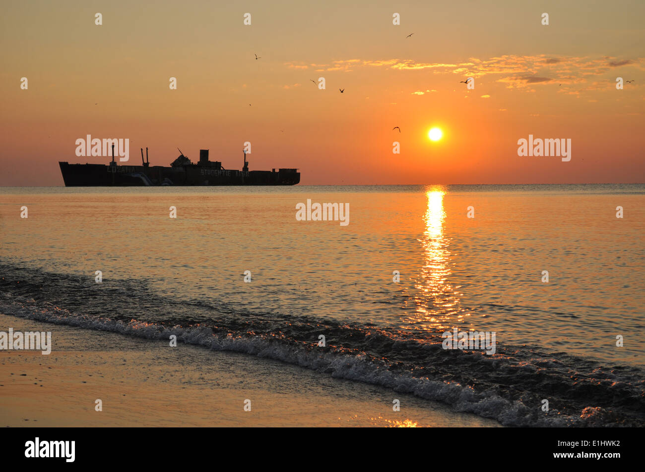sunrise with a ship, crock silhouette Stock Photo