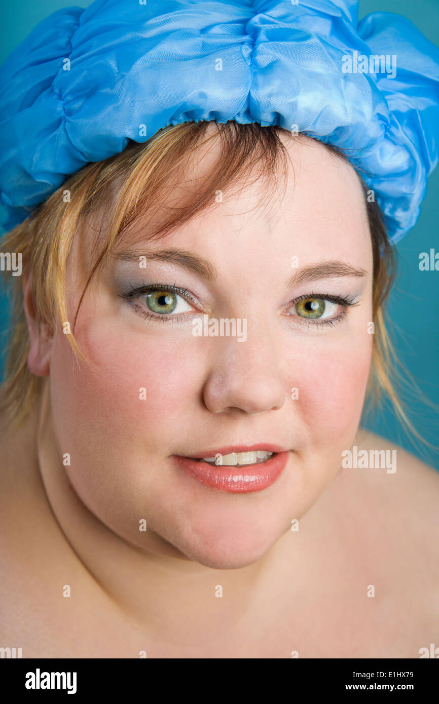 Midadult woman wearing shower cap Stock Photo Alamy
