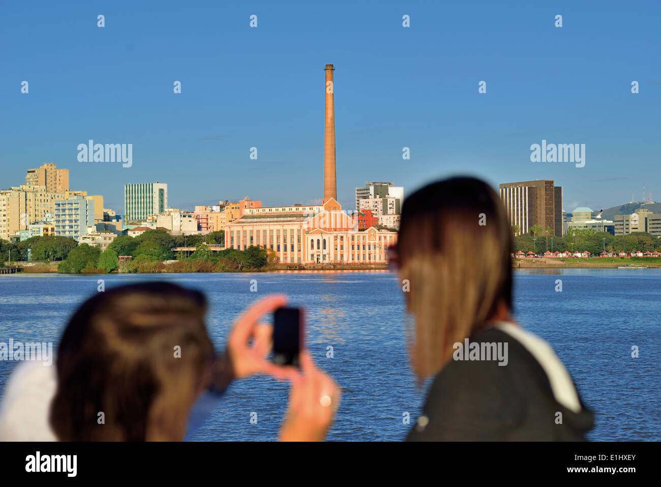 Brazil, Porto Alegre: Friends and tourists from Sao Paulo taking self portraits during boat trip on the lake Guaíba Stock Photo