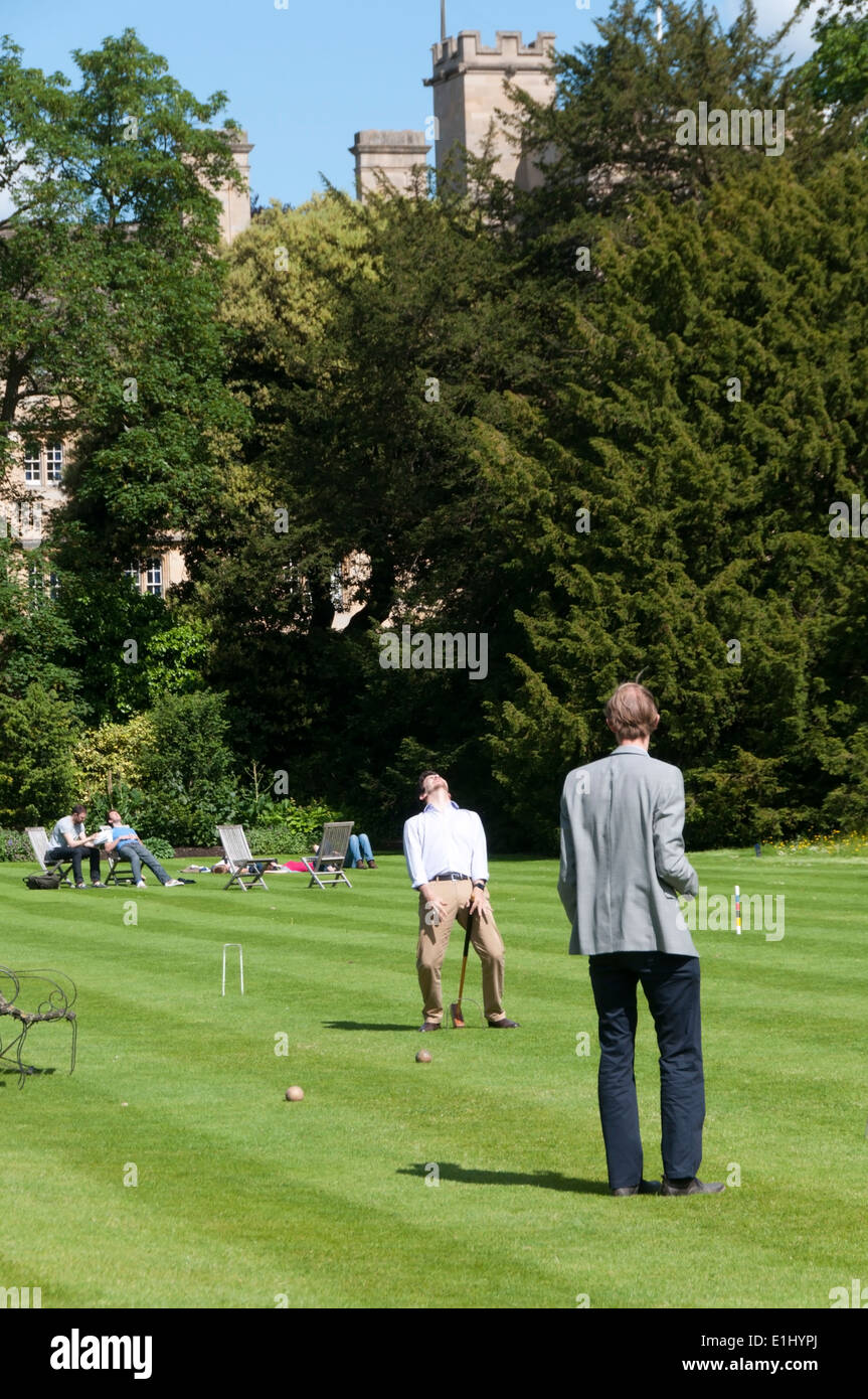 Students playing croquet on the lawn of Trinity College garden, Oxford. Stock Photo