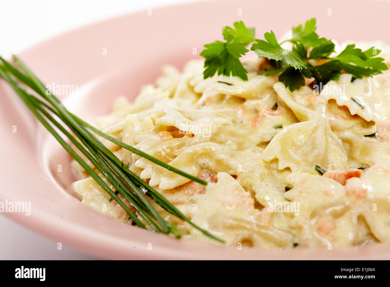 Farfalle pasta with smoked salmon and cheese sauce Stock Photo Alamy