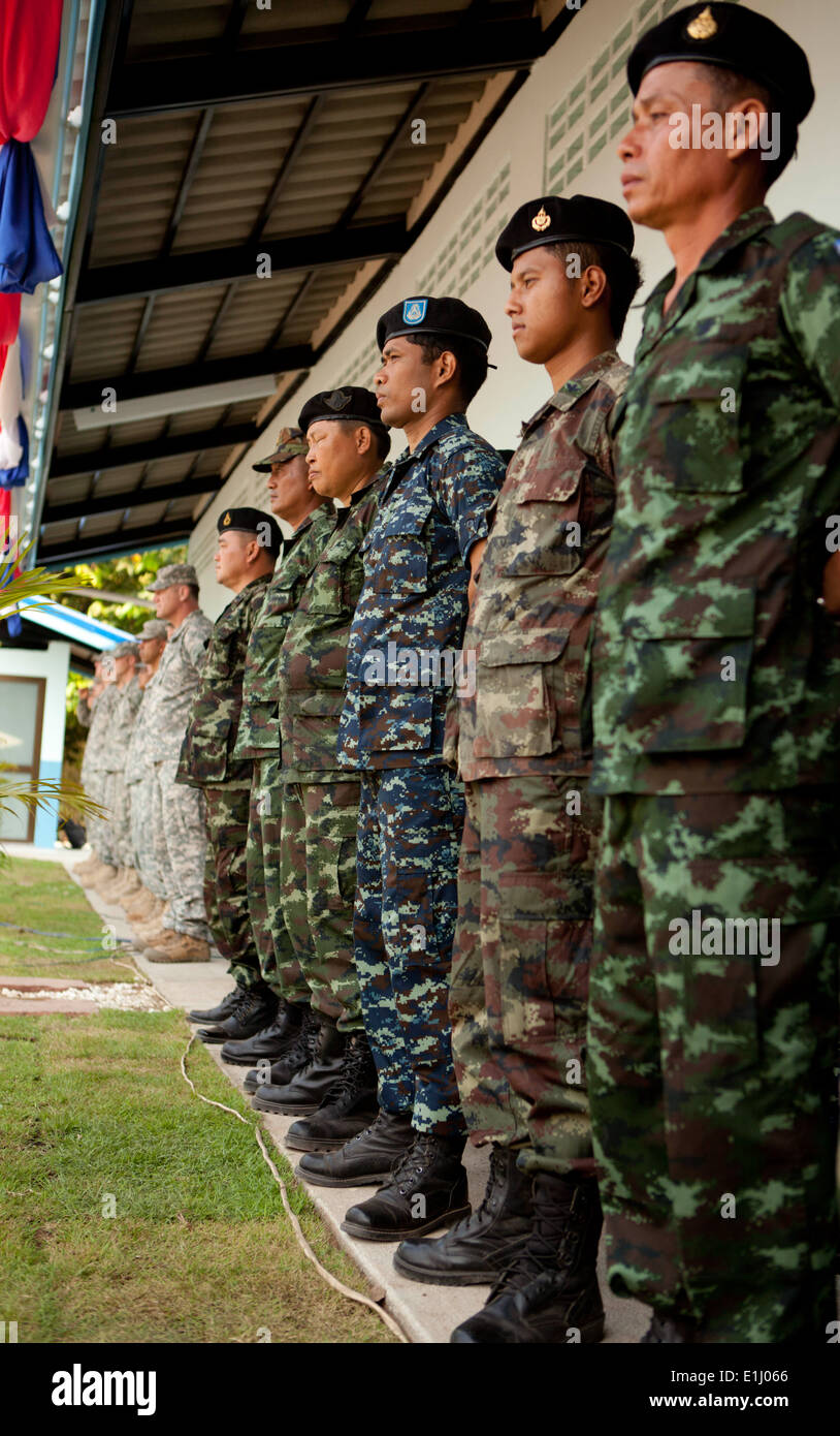 Thai and U.S. soldiers stand in formation during the dedication of a multipurpose building that was built as part of Cobra Gold Stock Photo