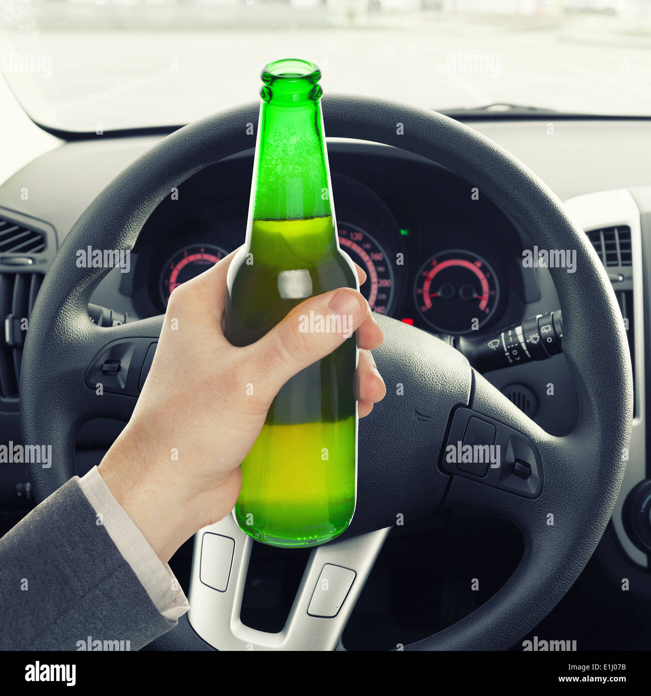 Man hand holding bottle of beer while driving - 1 to 1 ratio Stock ...