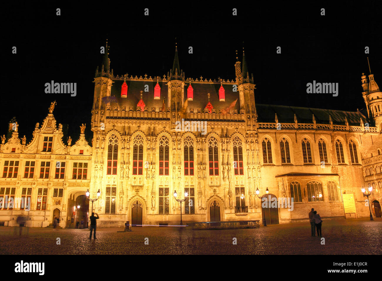 City Hall and Old Civil Registry building lit up at night, Burg Square, Bruges, Belgium Stock Photo