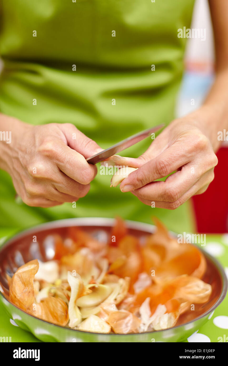 Hands adult woman peeling hi-res stock photography and images - Alamy