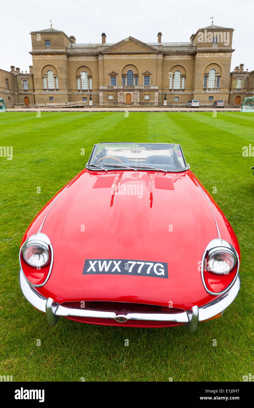 Vintage E-type Jaguar parked on lawn at Holkham Hall in Norfolk Stock Photo