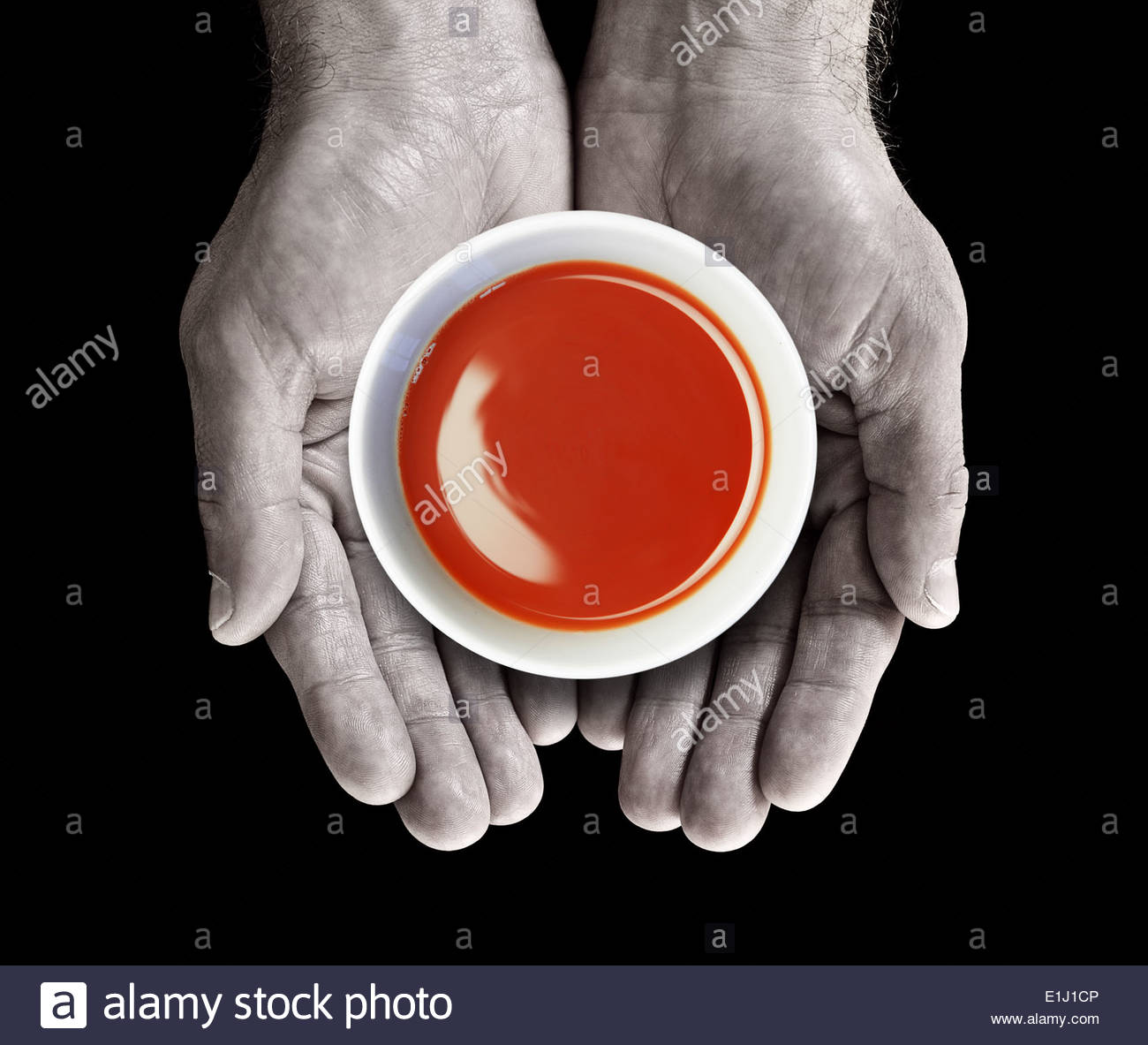 tomato soup bowl in hands E1J1CP