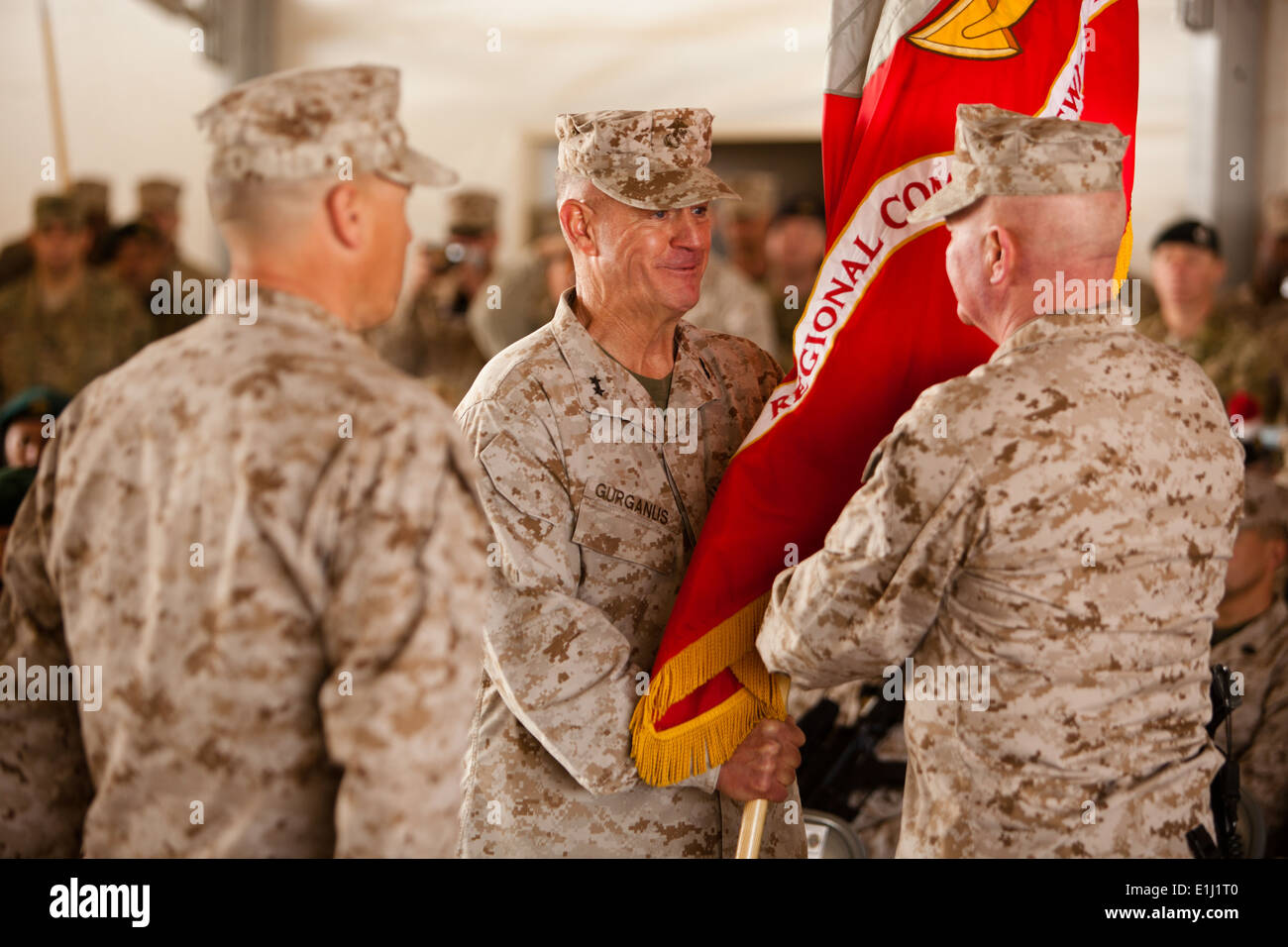 Maj. Gen. Charles M. Gurganus passes the colors to Maj. Gen. Walter L. Miller, Jr. during the transfer of authority ceremony on Stock Photo