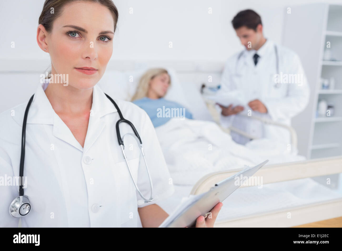Doctor holding folder hi-res stock photography and images - Alamy