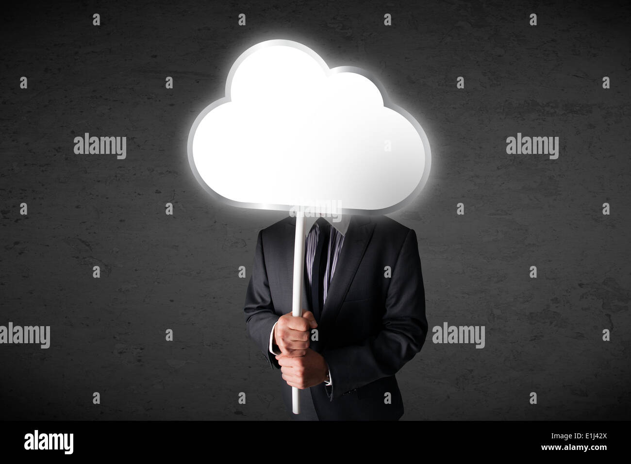 Businessman holding a cloud Stock Photo - Alamy