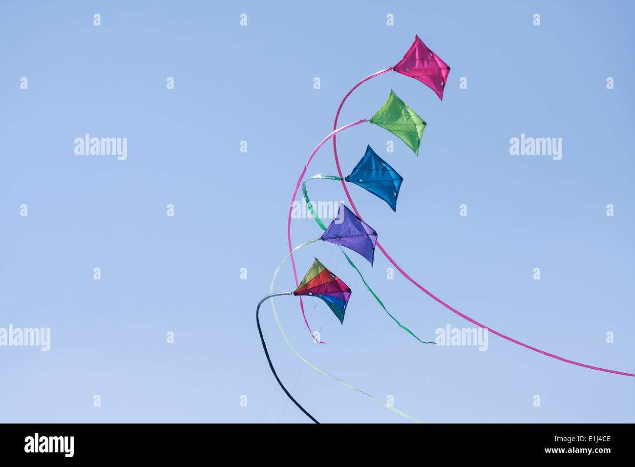 Germany, Hamburg, colourful kites, blue sky Stock Photo Alamy