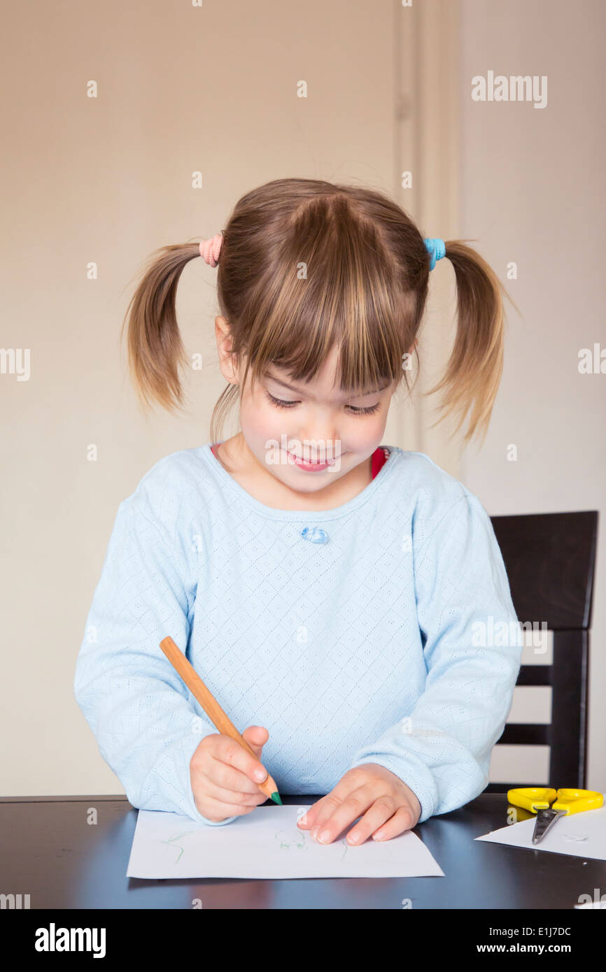 Portrait of little girl with green crayon Stock Photo - Alamy