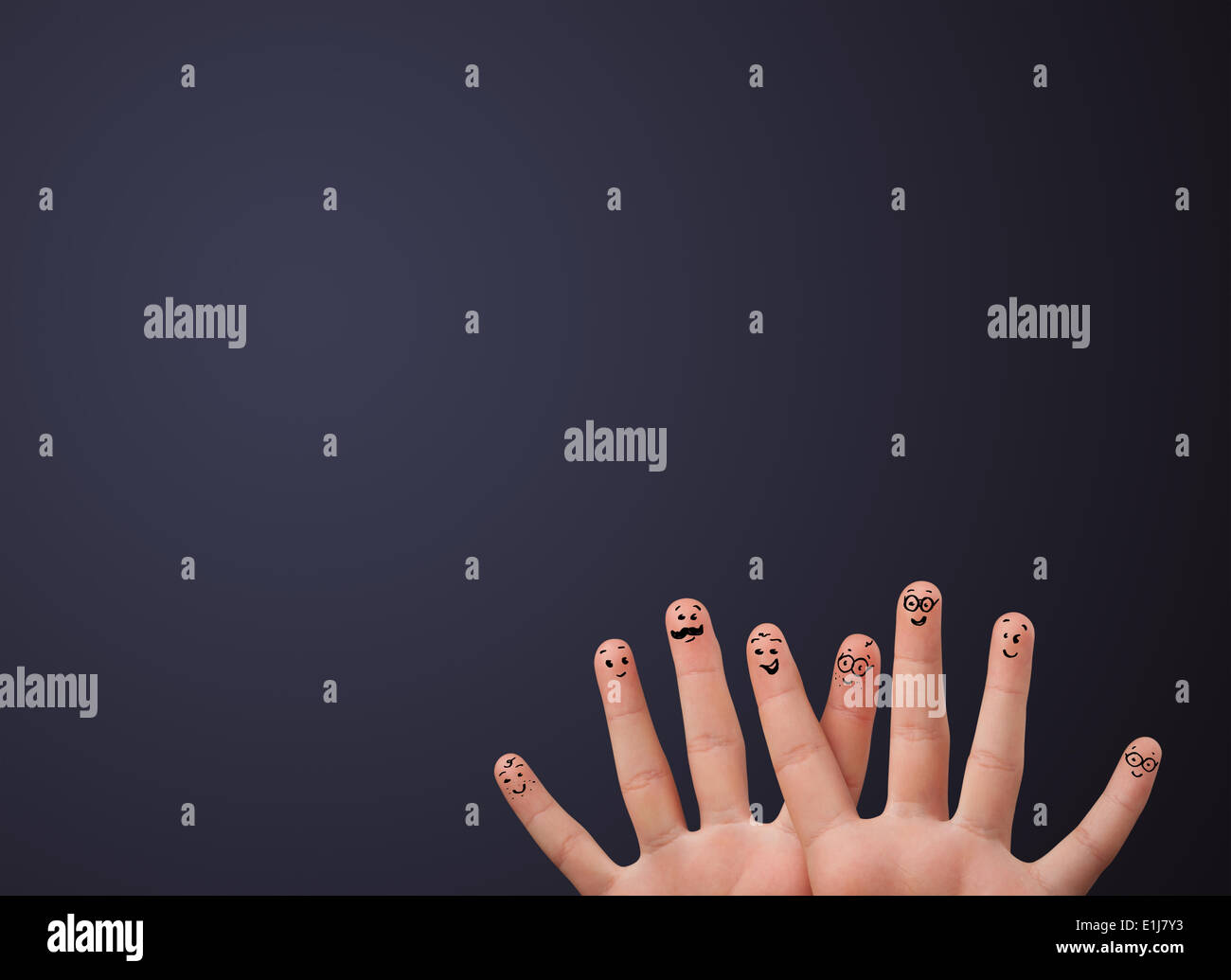 Happy smiley fingers looking at empty wall copyspace Stock Photo