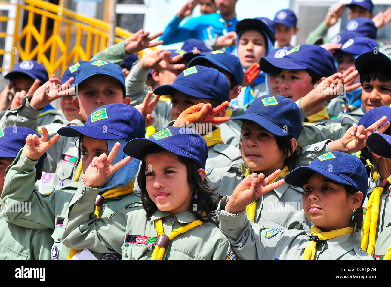 Afghan Scouts salute volunteers at the closing ceremony of the Afghan