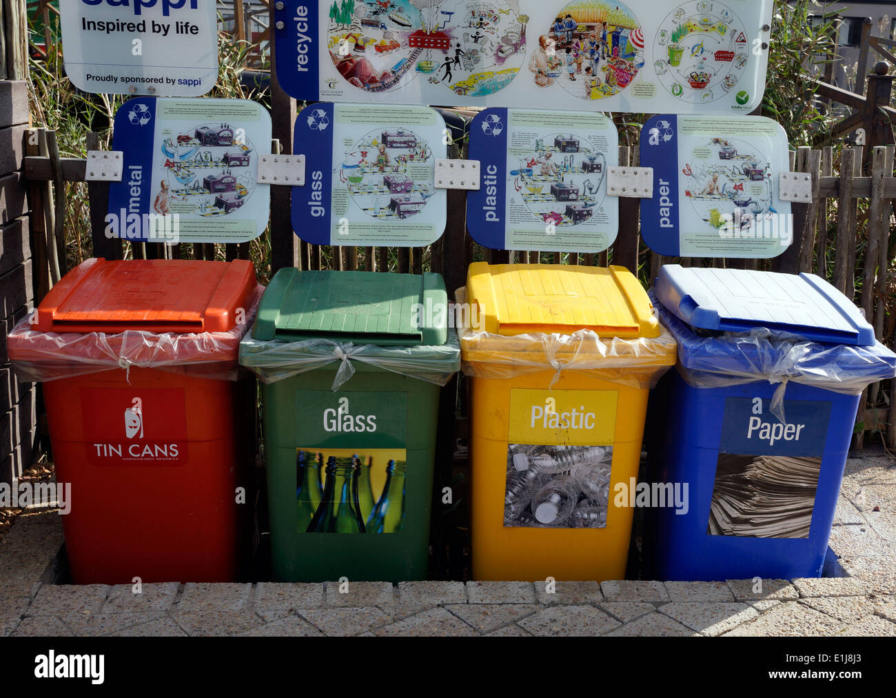 Brightly coloured recycling wheelie bins at Intaka Island bird sanctuary near Cape Town Stock