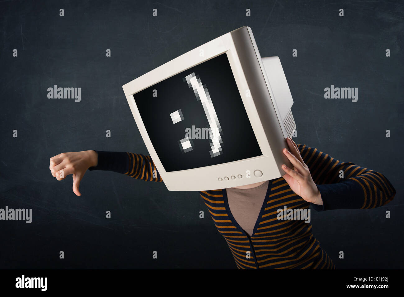 Funny girl with a monitor box on her head and a smiley face Stock Photo
