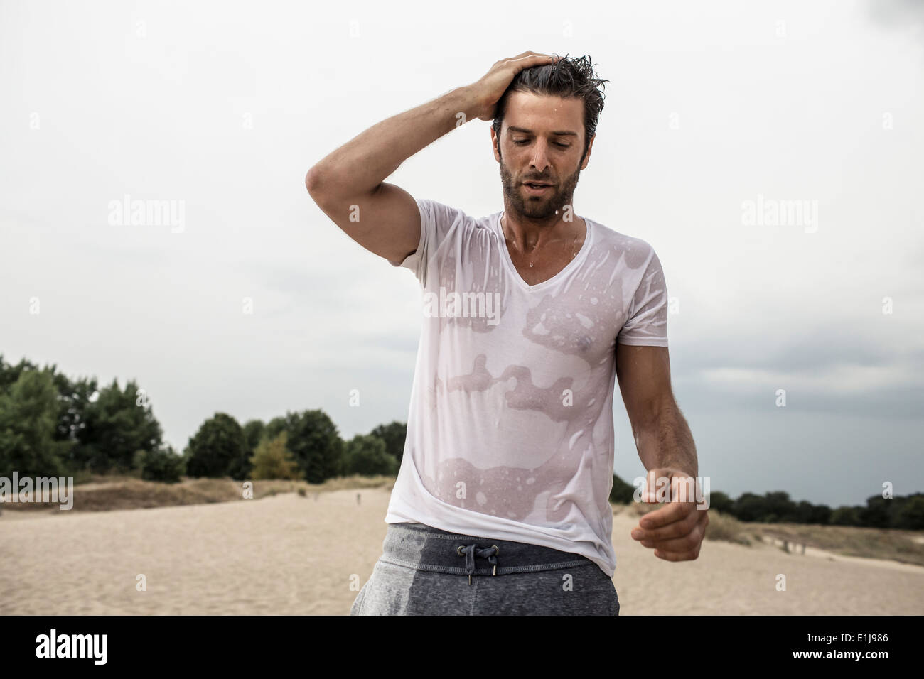 Portrait of man with wet t-shirt Stock Photo - Alamy