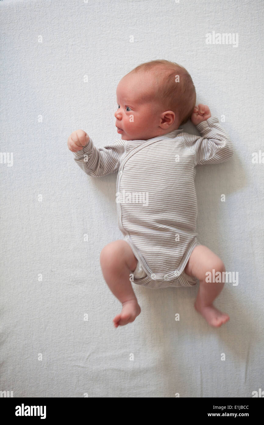 Newborn lying on blanket, view from above Stock Photo