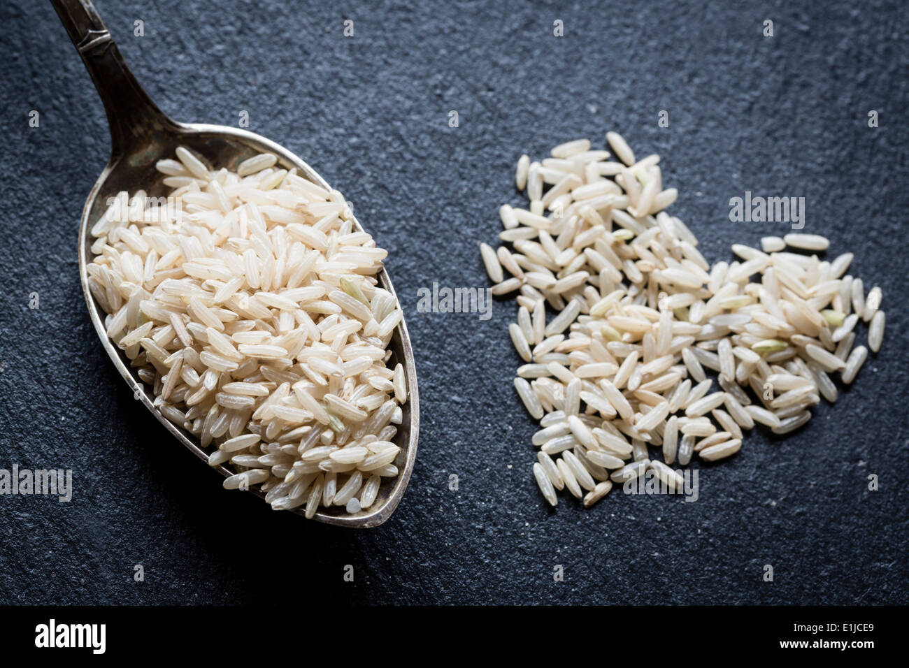 Slate Rice Spoon brown rice close hi-res stock photography and images - Alamy