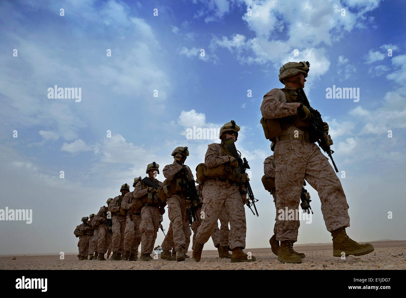 U.S. Marines assigned to Lima Company, 3rd Battalion, 2nd Marine Regiment, 26th Marine Expeditionary Unit walk to their tempora Stock Photo