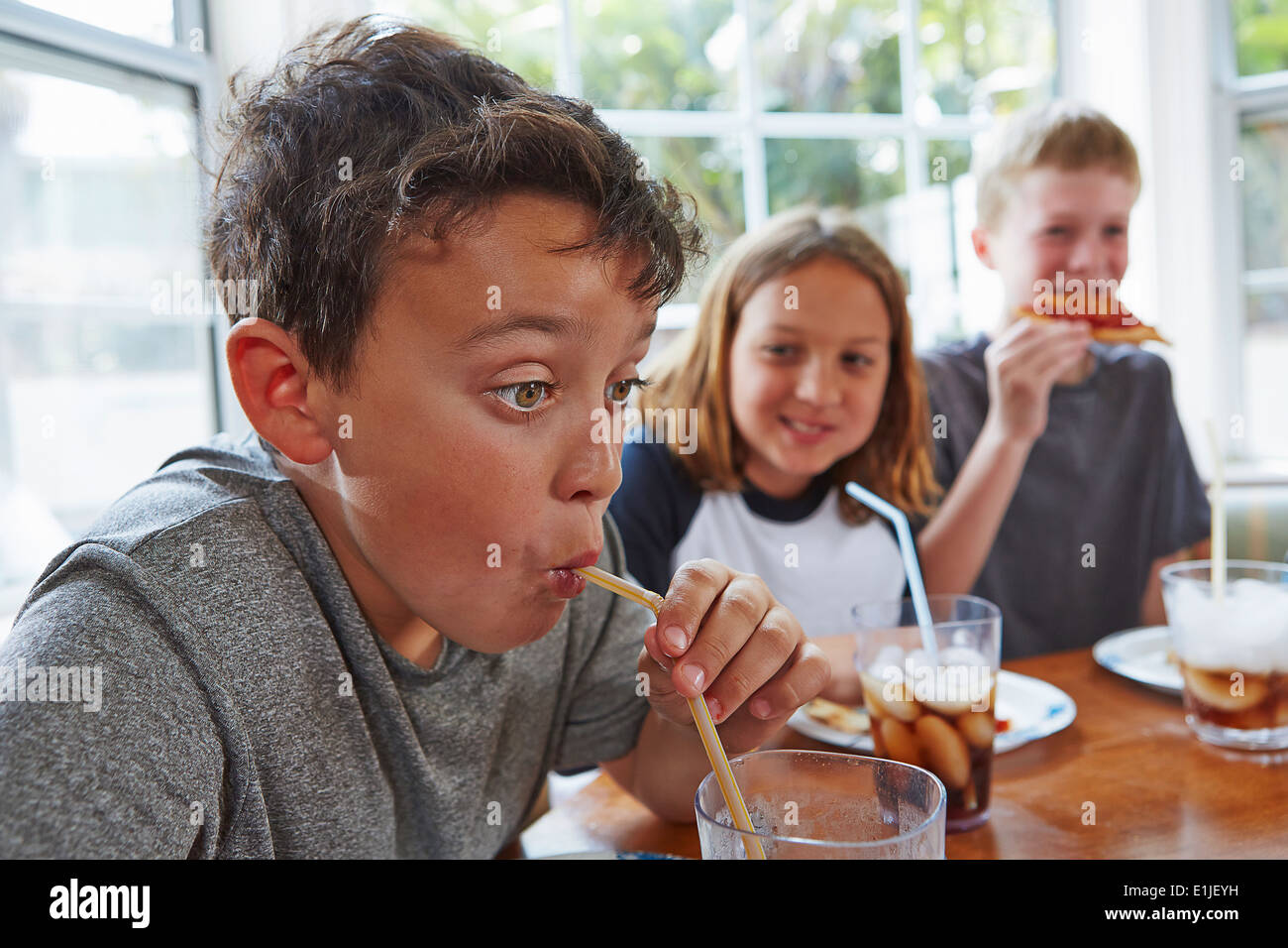 Child drinking through straw hires stock photography and images Alamy