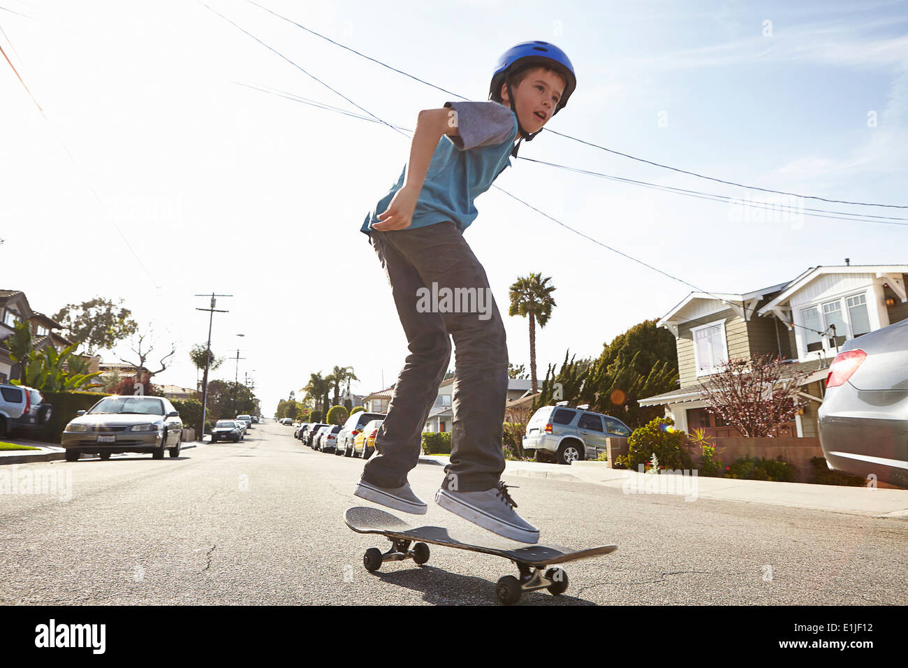 Boy skateboarding on road Stock Photo Alamy