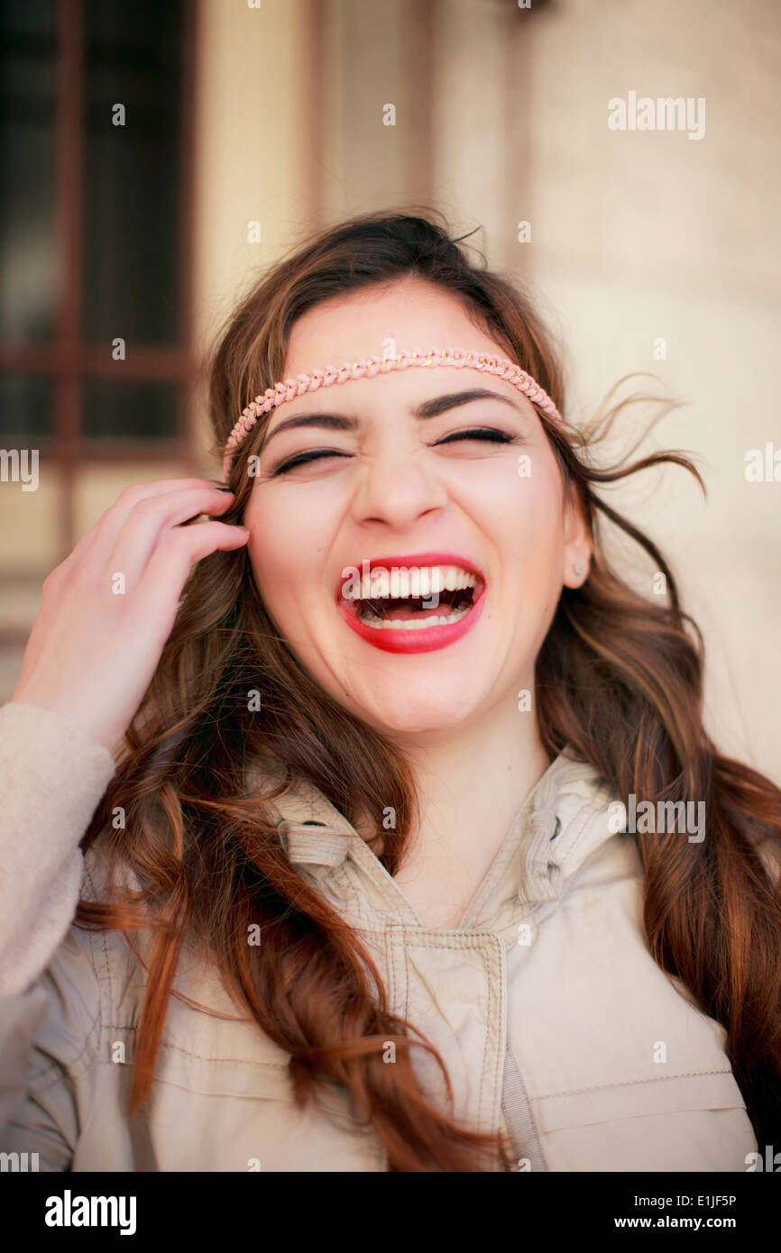 Portrait of young woman laughing Stock Photo