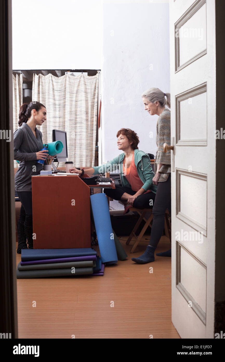 Woman crossed legs standing office hi-res stock photography and images ...