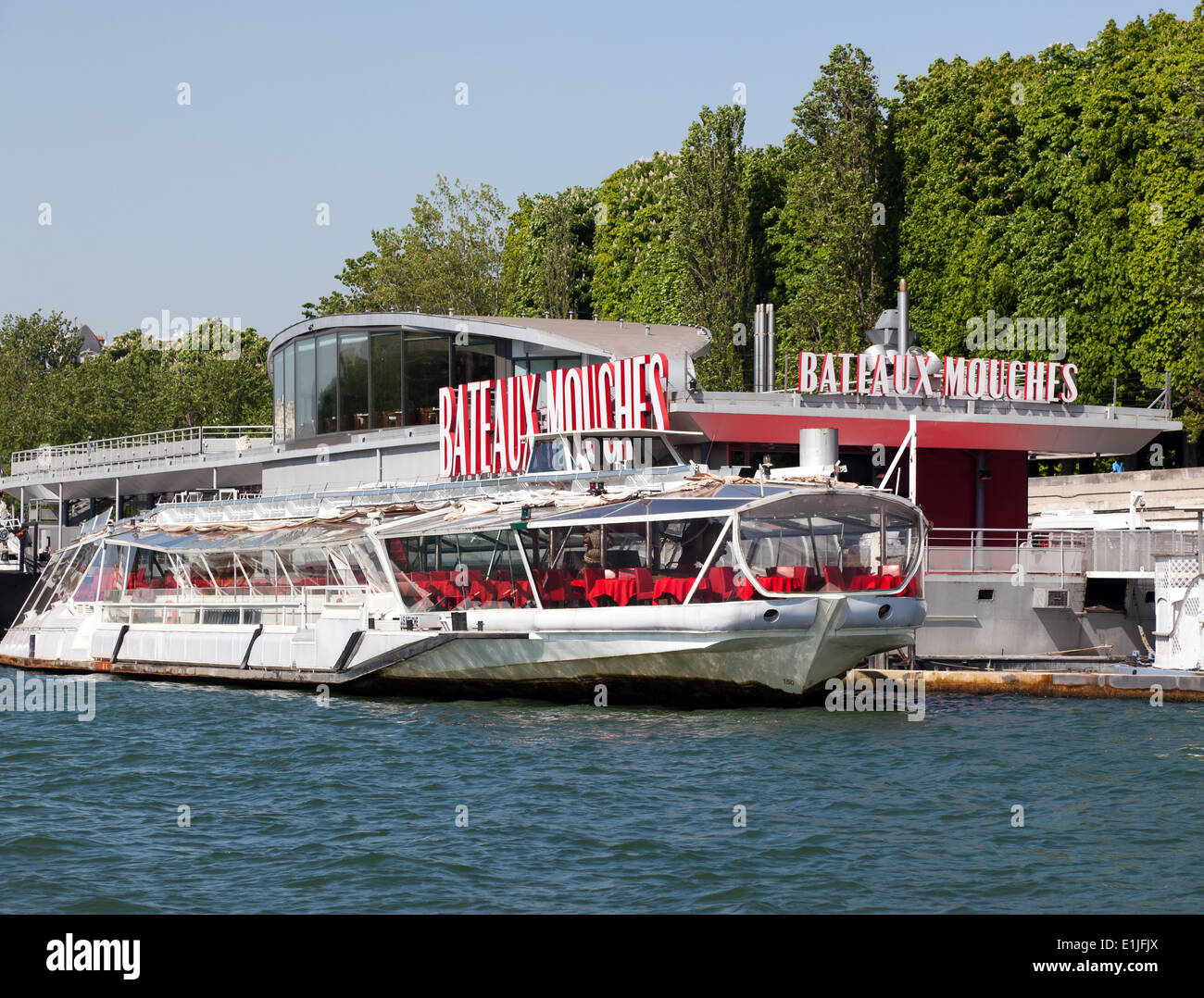A  Bateaux Mouches, moored alongside its headquarters on the River Seine, Paris, France. Stock Photo