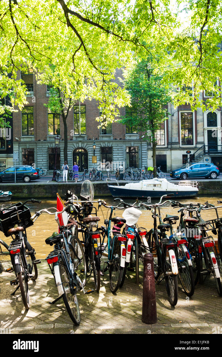 Bikes parked on a canal in Amsterdam The Netherlands Stock Photo Alamy