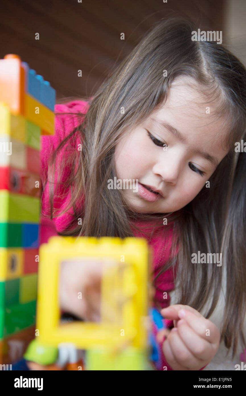 Girl playing by herself Stock Photo