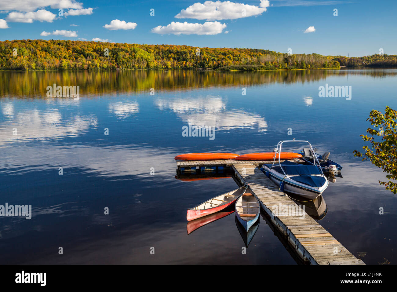 A small boat dock on the Saint-Maurice River in Shawinigan, Quebec, Canada. Stock Photo