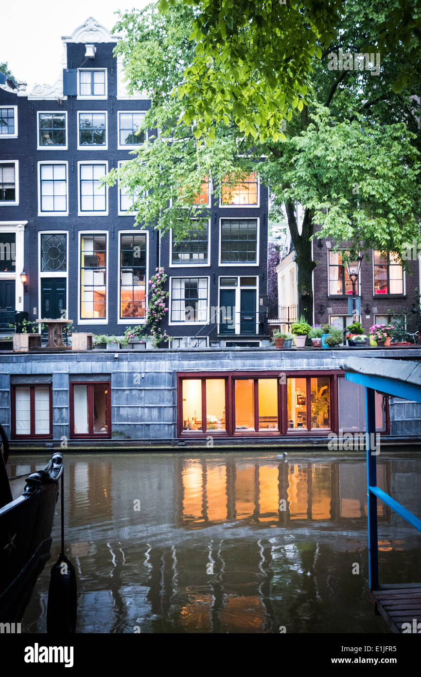Canal with houseboats in Amsterdam, The Netherlands Stock Photo Alamy