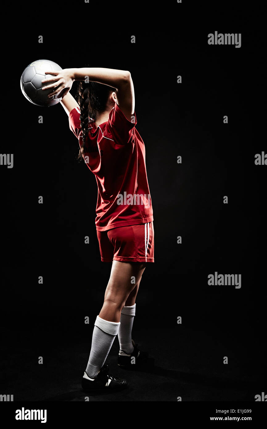 Young woman throwing football Stock Photo Alamy
