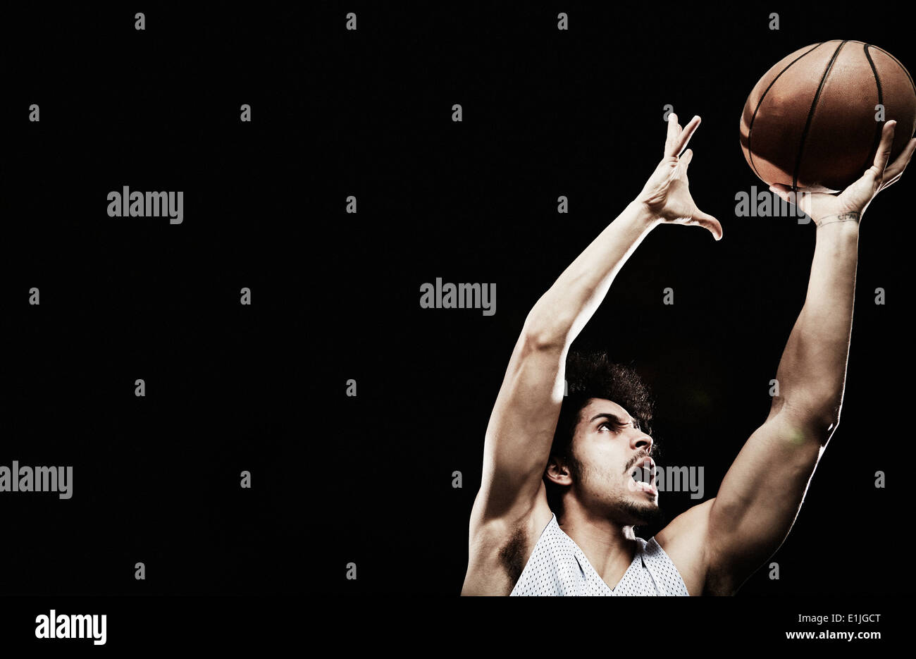 Basketball player catching basketball Stock Photo Alamy