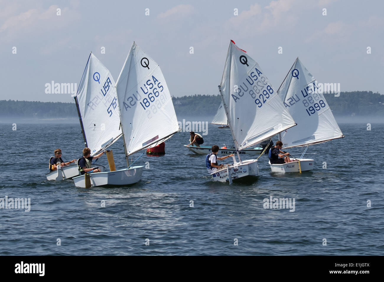 Junior sailors in Optimist Dinghies Stock Photo