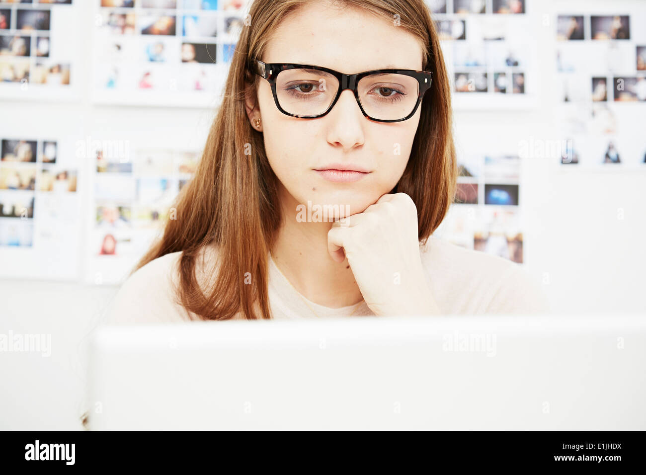 Young woman wearing glasses using computer Stock Photo Alamy