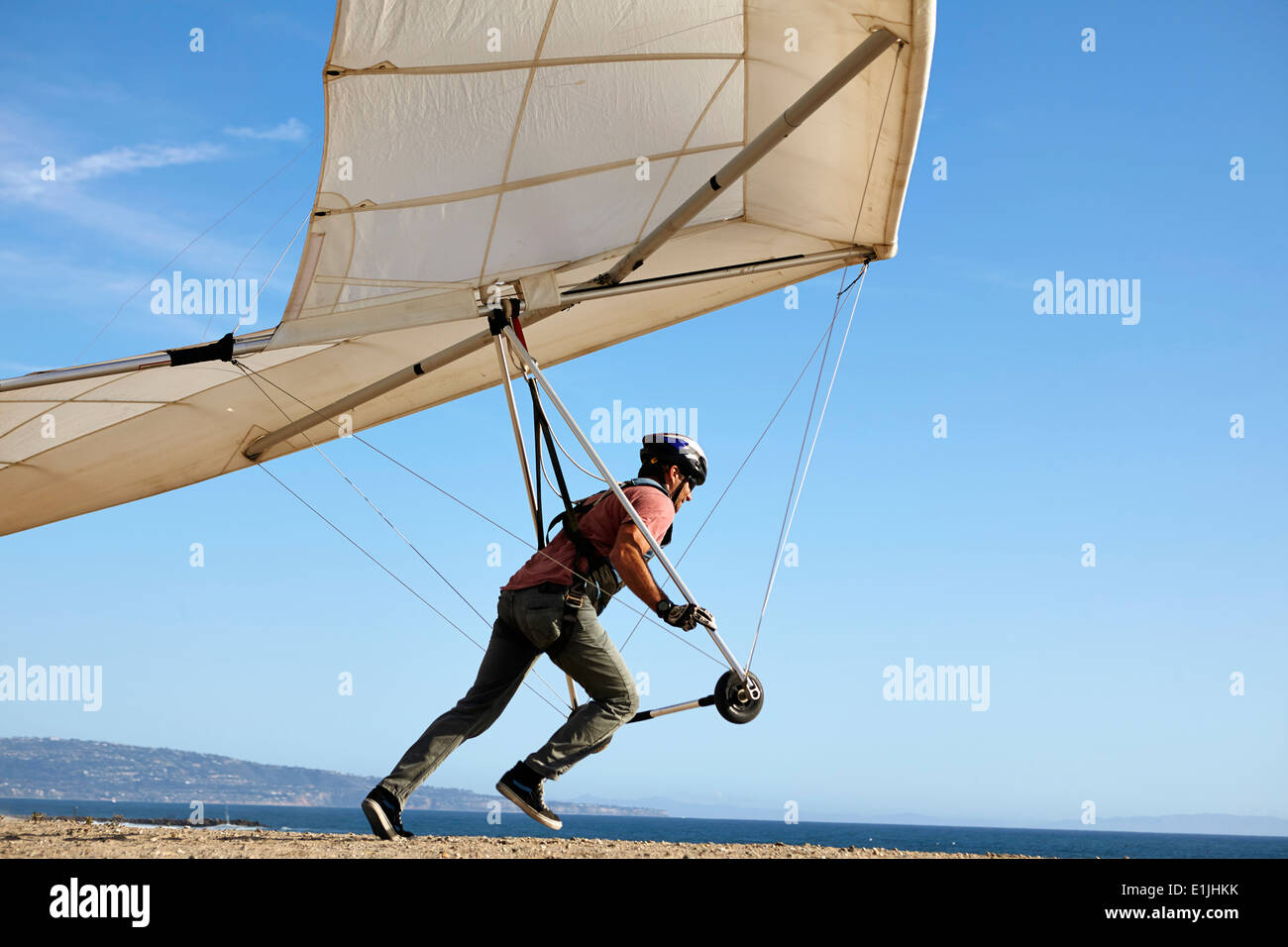Hang glider pilot taking off Stock Photo Alamy