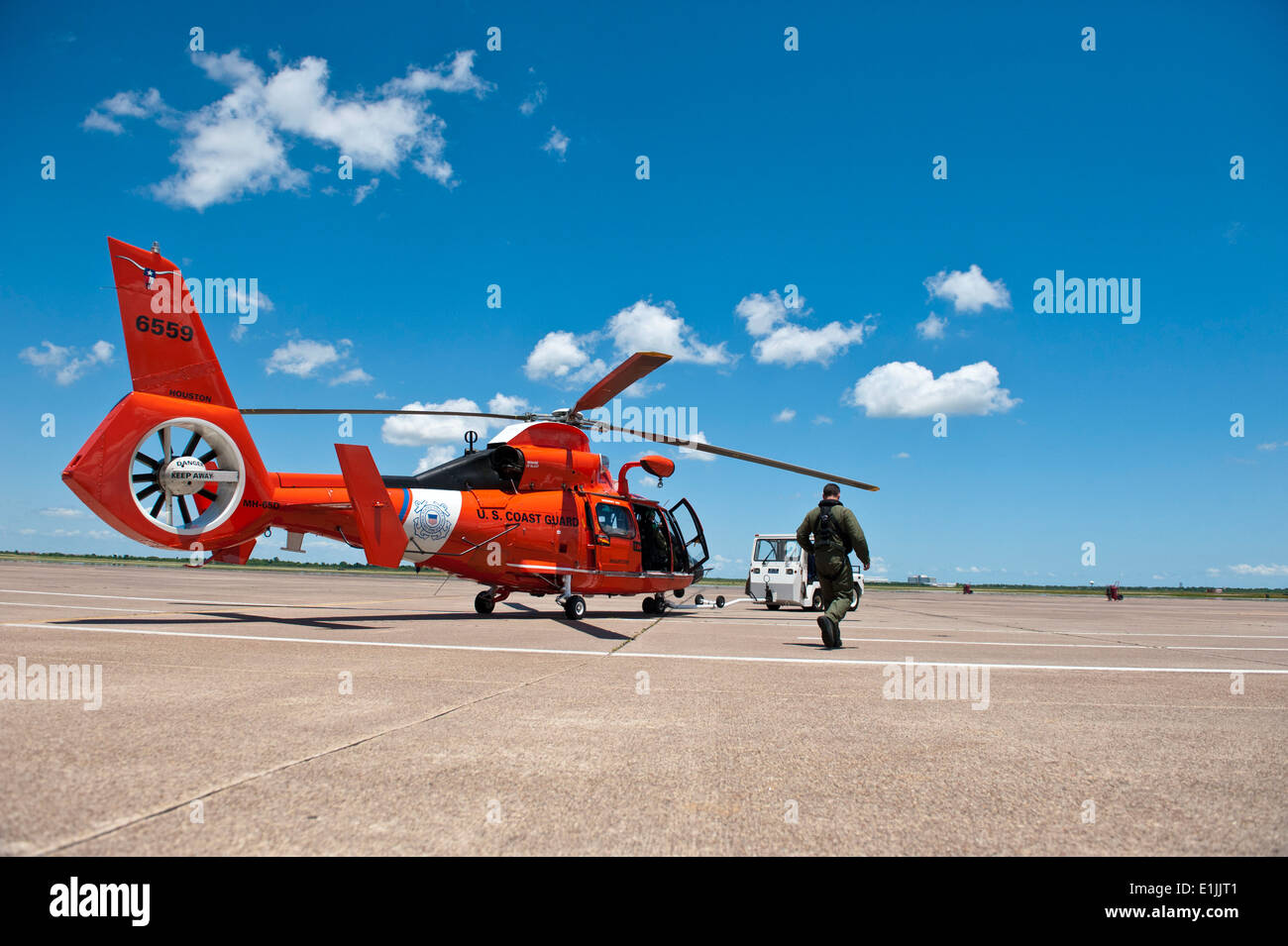 A U.S. Coast Guard Air Station Houston aircrew prepares to launch a MH65C Dolphin helicopter to