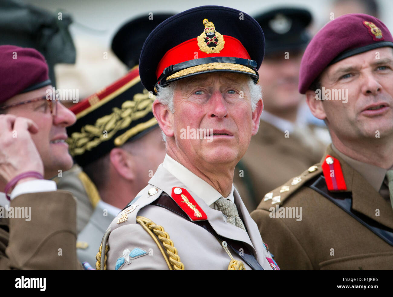 Ranville, France. 05th June, 2014. Charles, Prince of Wales watches the landing of parachutists in the Normandy near Ranville, France, 05 June 2014. Several events commemorate the 70th anniversary of the landings of the Allied Forces in the Normandy on 06 June. The largest landings operation in history began the liberation of western Europe from National Socialism during the Second World War. Photo: MICHAEL KAPPELER/dpa/Alamy Live News Stock Photo