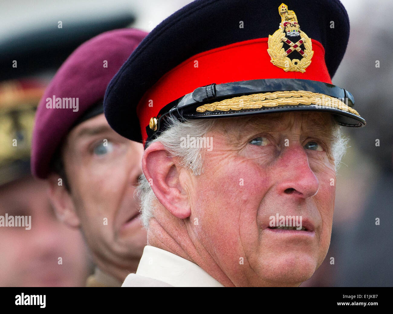 Ranville, France. 05th June, 2014. Charles, Prince of Wales watches the landing of parachutists in the Normandy near Ranville, France, 05 June 2014. Several events commemorate the 70th anniversary of the landings of the Allied Forces in the Normandy on 06 June. The largest landings operation in history began the liberation of western Europe from National Socialism during the Second World War. Photo: MICHAEL KAPPELER/dpa/Alamy Live News Stock Photo
