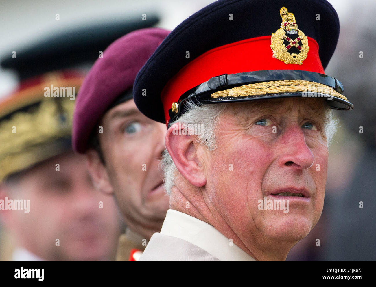 Ranville, France. 05th June, 2014. Charles, Prince of Wales watches the landing of parachutists in the Normandy near Ranville, France, 05 June 2014. Several events commemorate the 70th anniversary of the landings of the Allied Forces in the Normandy on 06 June. The largest landings operation in history began the liberation of western Europe from National Socialism during the Second World War. Photo: MICHAEL KAPPELER/dpa/Alamy Live News Stock Photo
