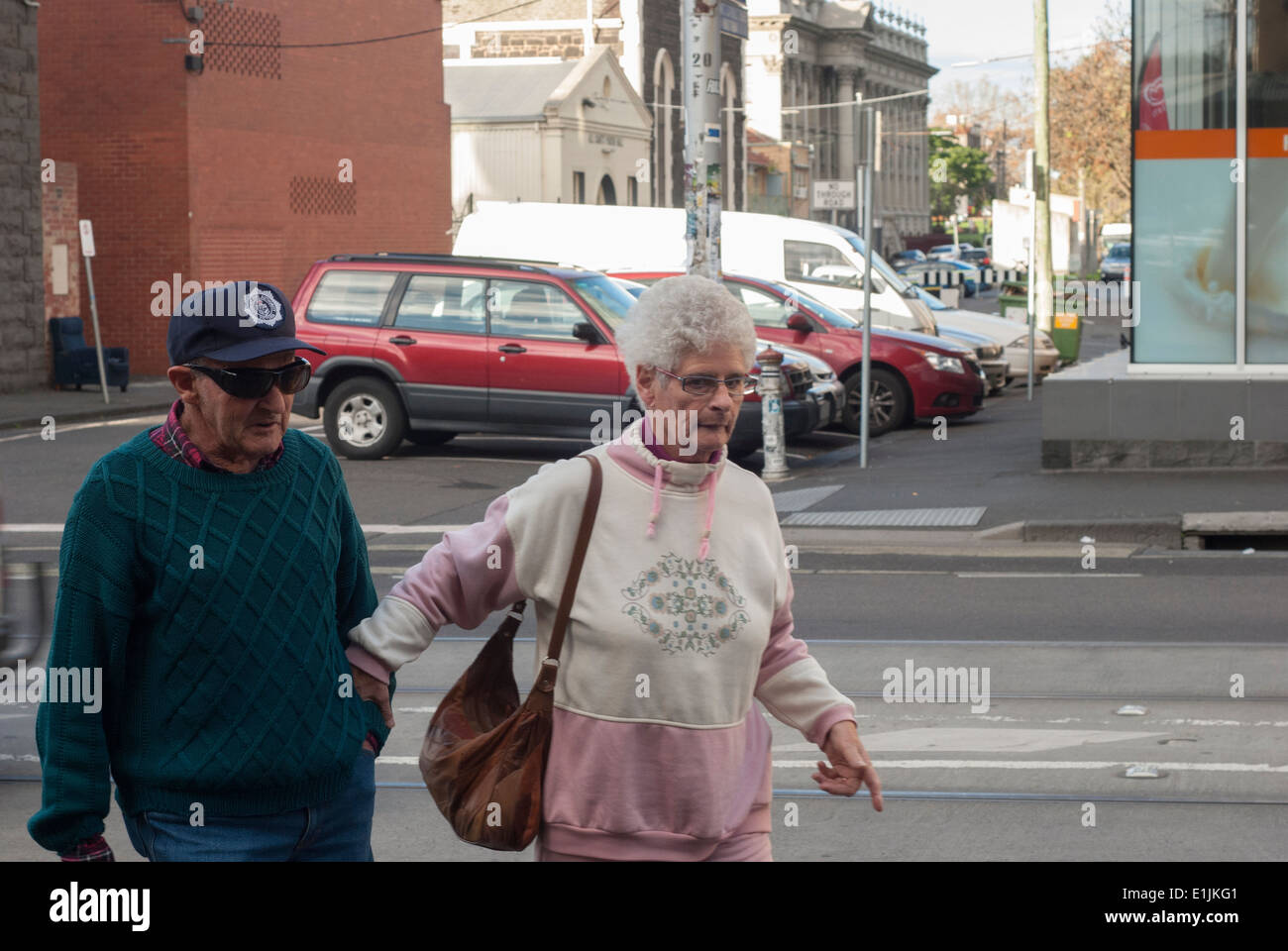 Elderly Couple Walking On Brunswick Street Fitzroy Melbourne Australia Stock Photo