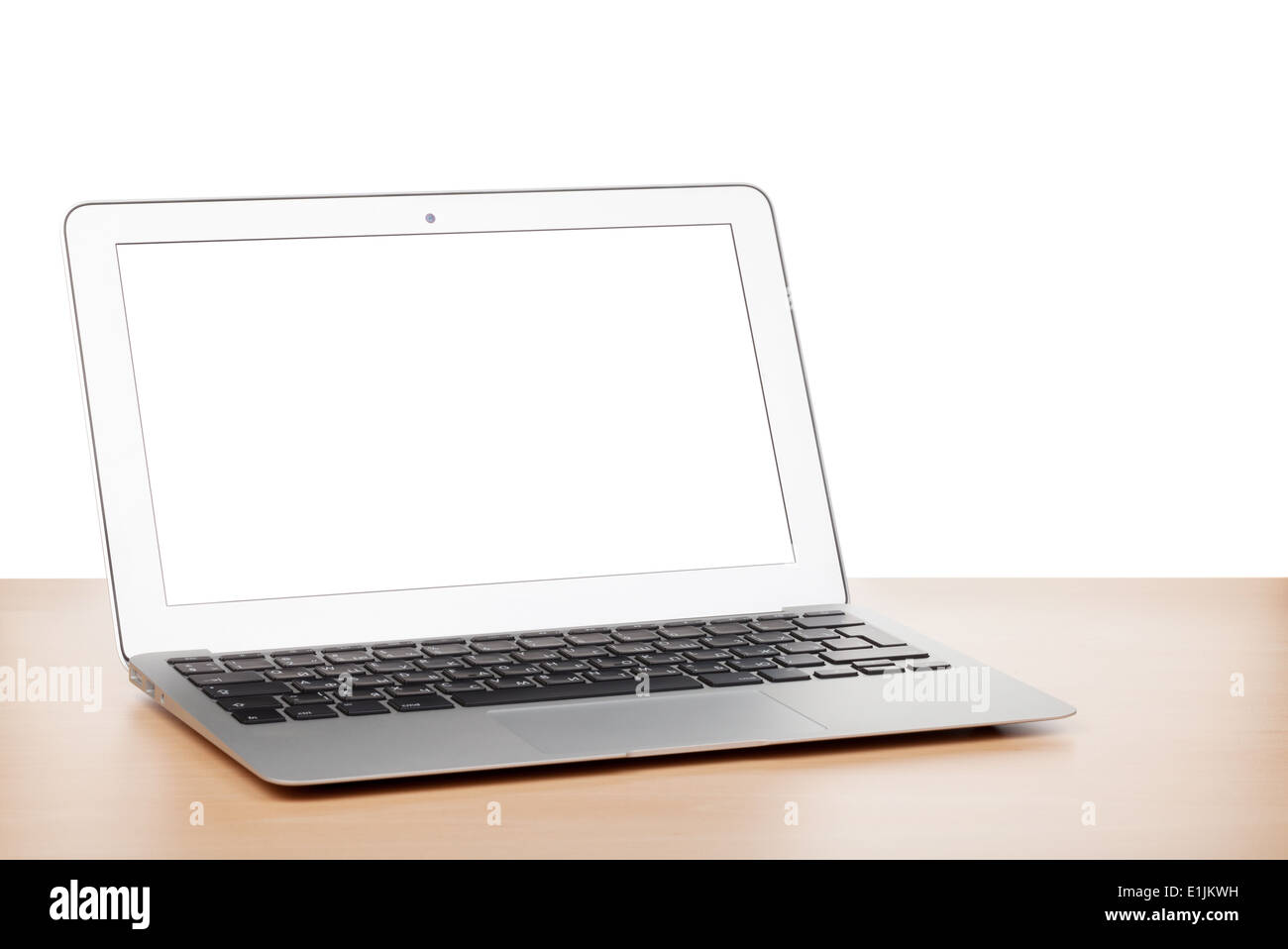 Laptop with blank screen on table. Isolated on white background Stock Photo