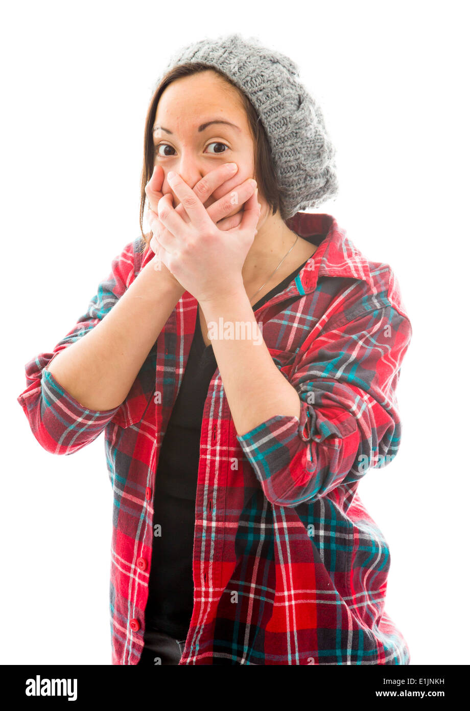 Young woman with hand over her mouth and shock Stock Photo