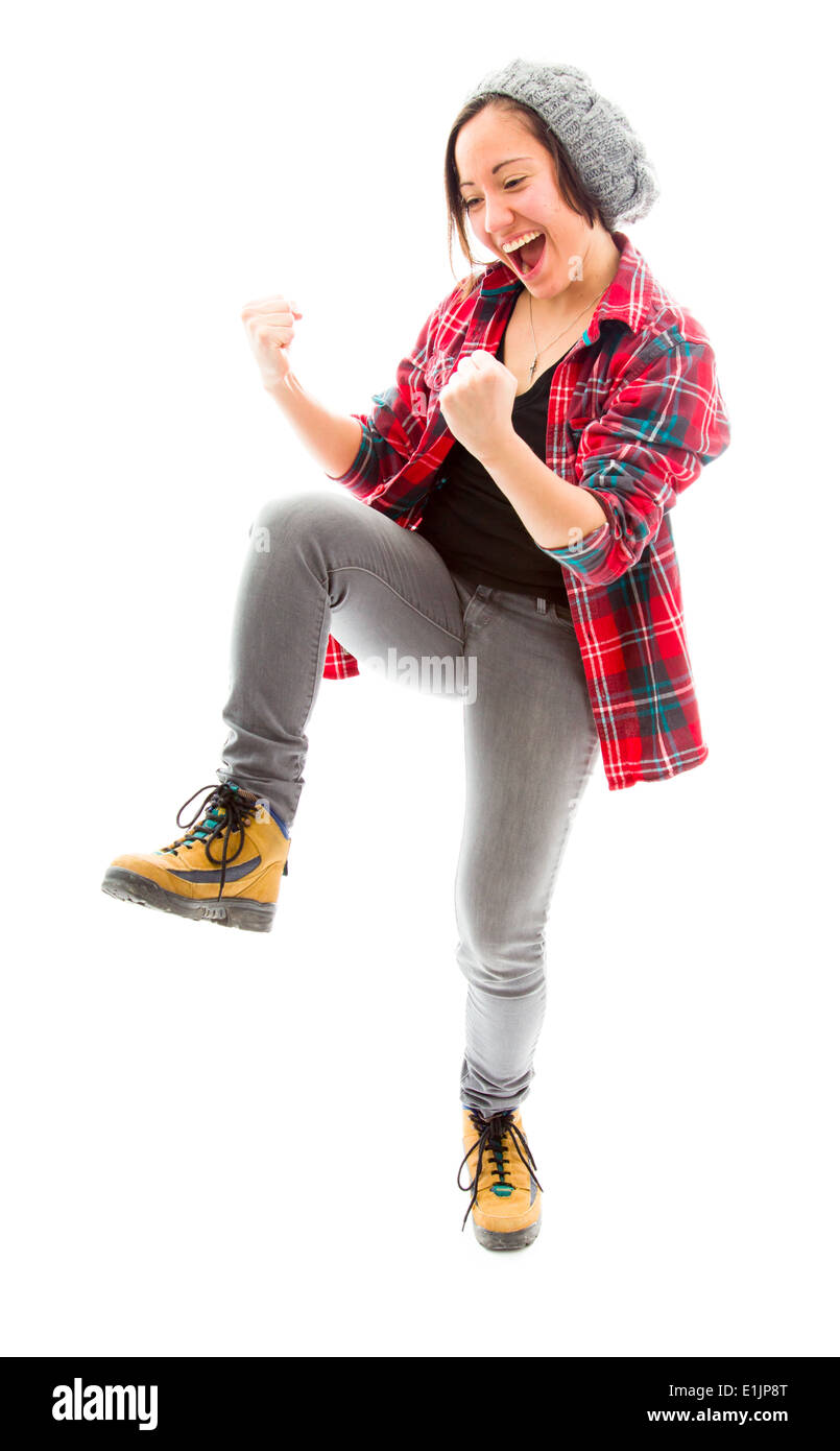 Young woman punching the air and laughing Stock Photo