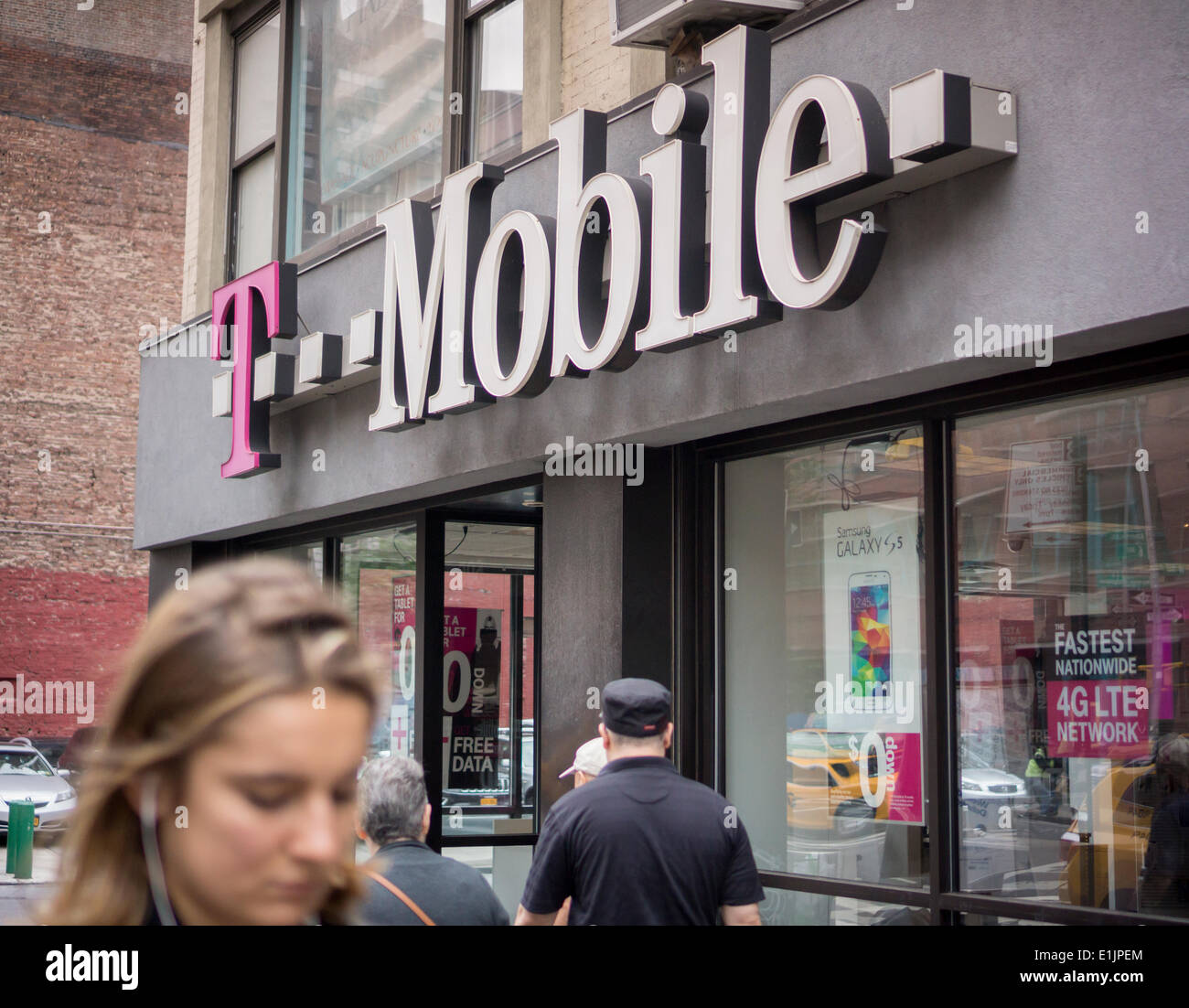 New York, NY, USA. 05th June, 2014. A T-Mobile USA store is seen in the Chelsea neighborhood of New York on Thursday, June 5, 2014. Sprint is reported to be near acquiring T-Mobile from Deutsche Telekom in a deal worth $32 billion. The two carriers, pending regulators' approval, will compete directly with the two giants, AT&T and Verizon.  Credit:  Richard Levine/Alamy Live News Stock Photo