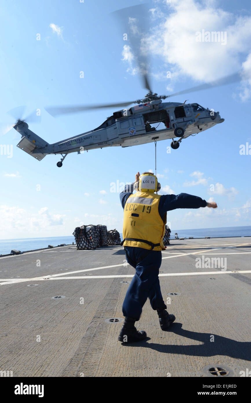 U.S. Navy Boatswain?s Mate 2nd Class Marc Poskarbiewicz directs